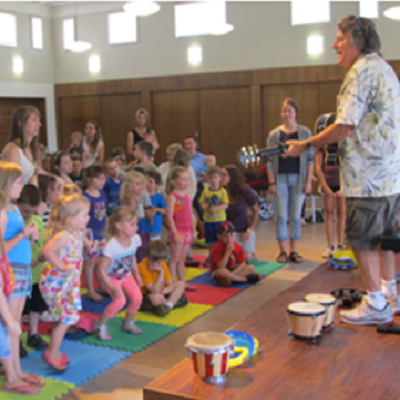 children listening to program presenter